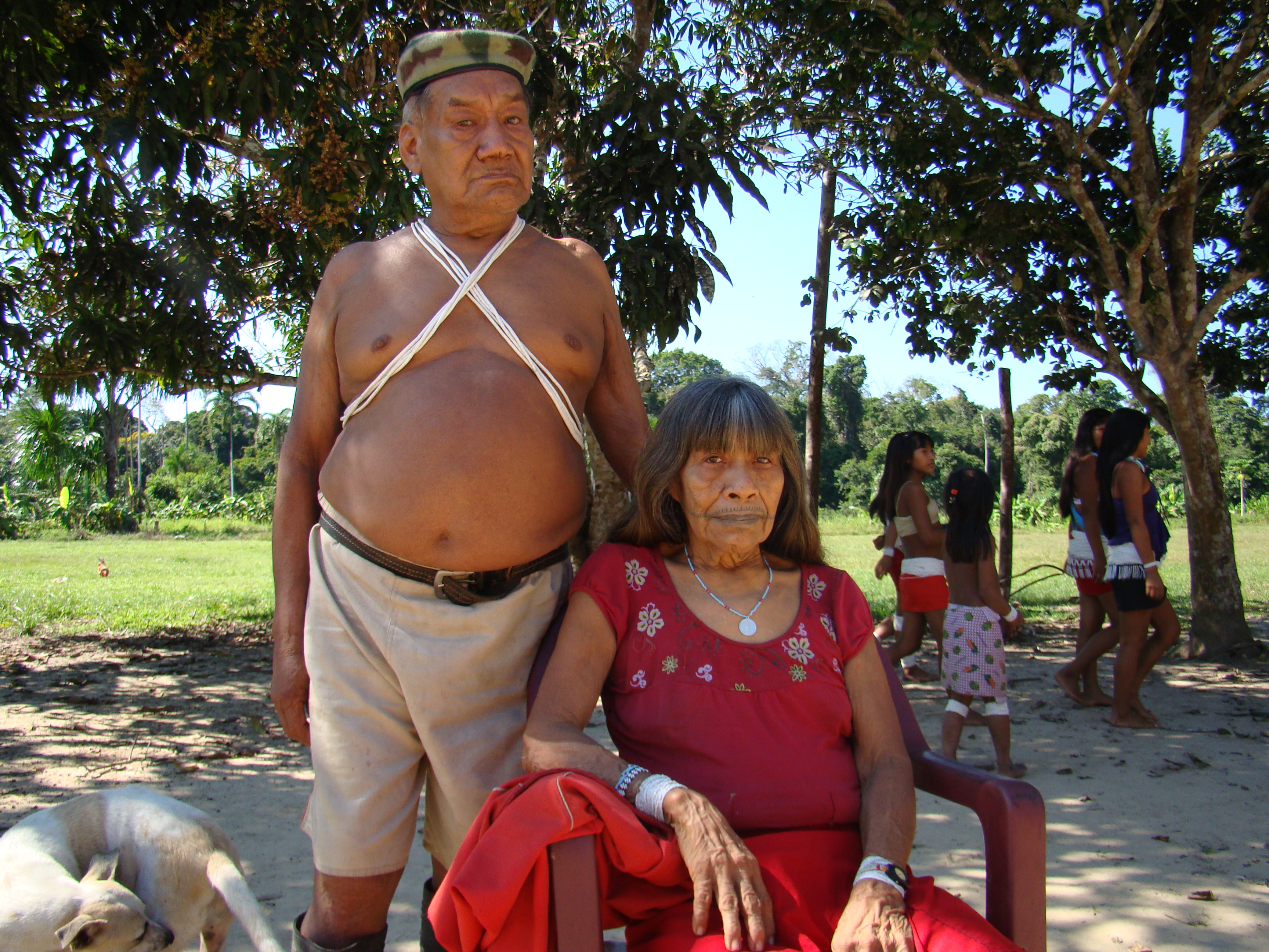 An elderly Marubo couple poses for a photograph.